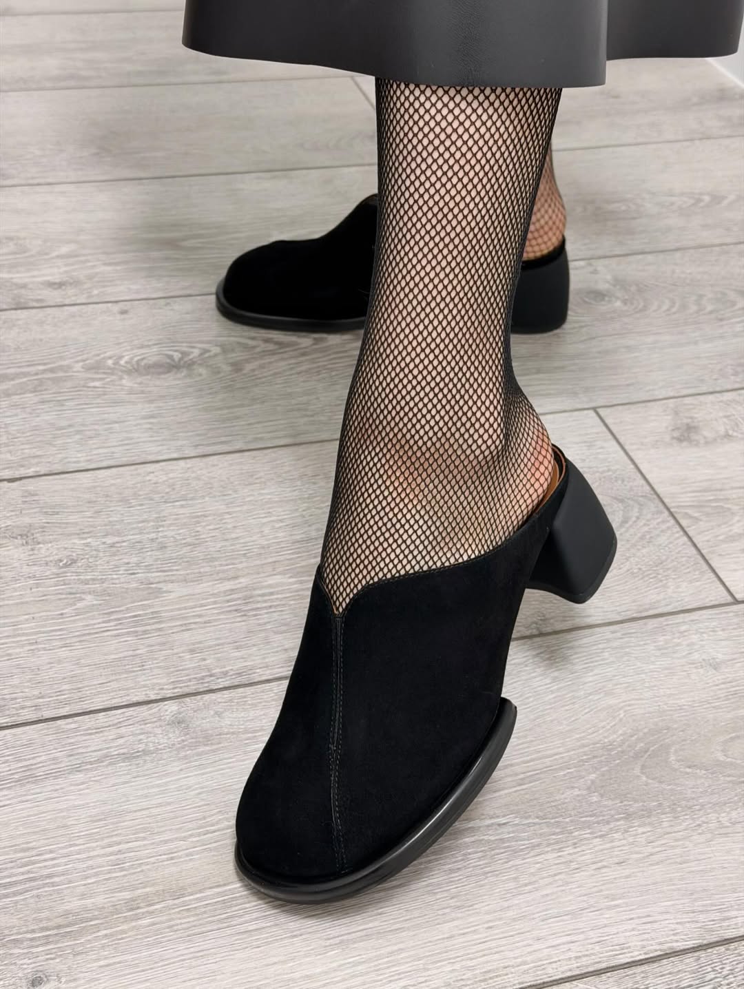 Black suede high-heeled shoes