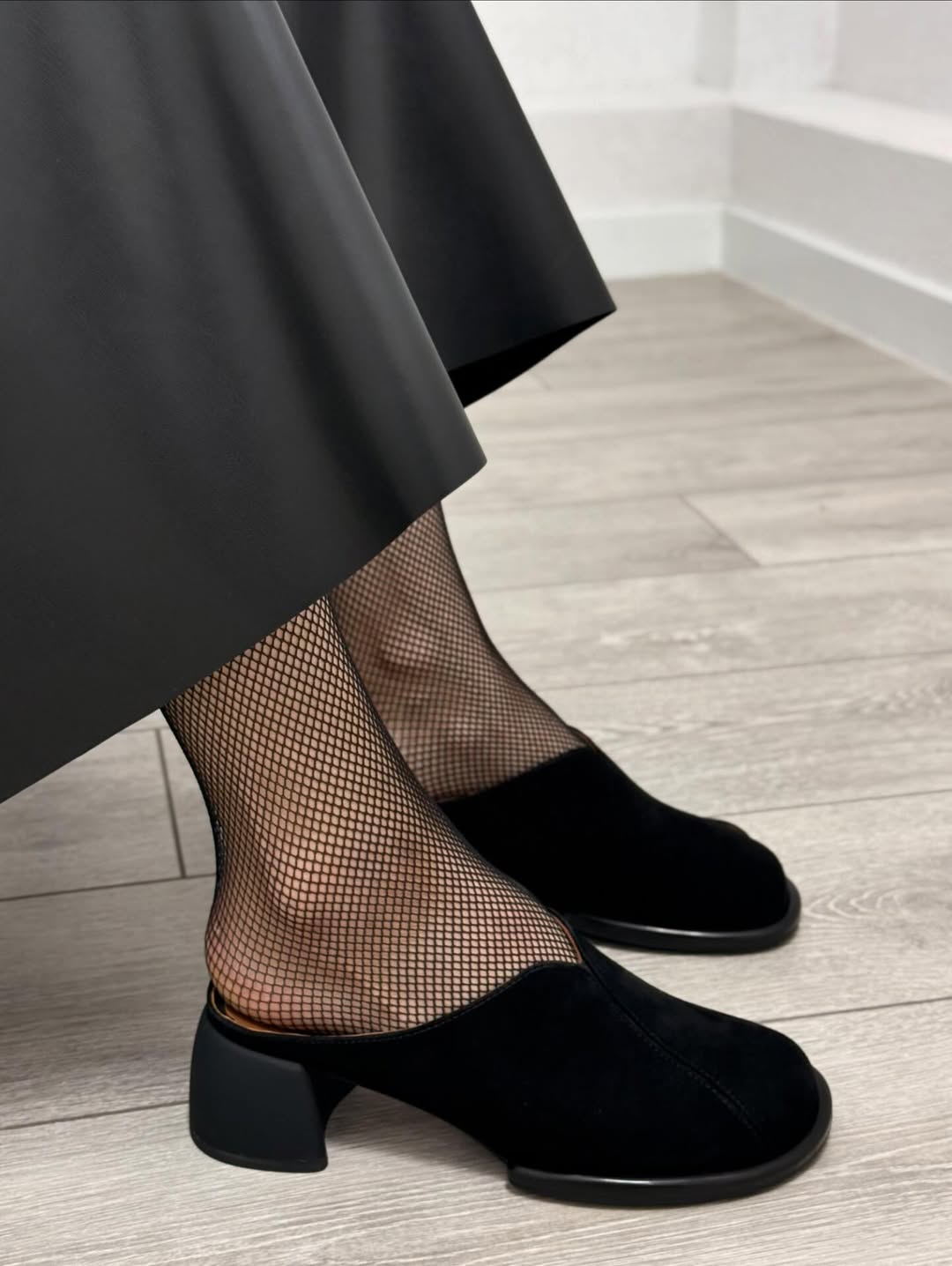 Black suede high-heeled shoes