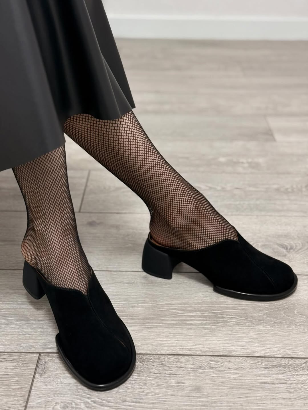Black suede high-heeled shoes