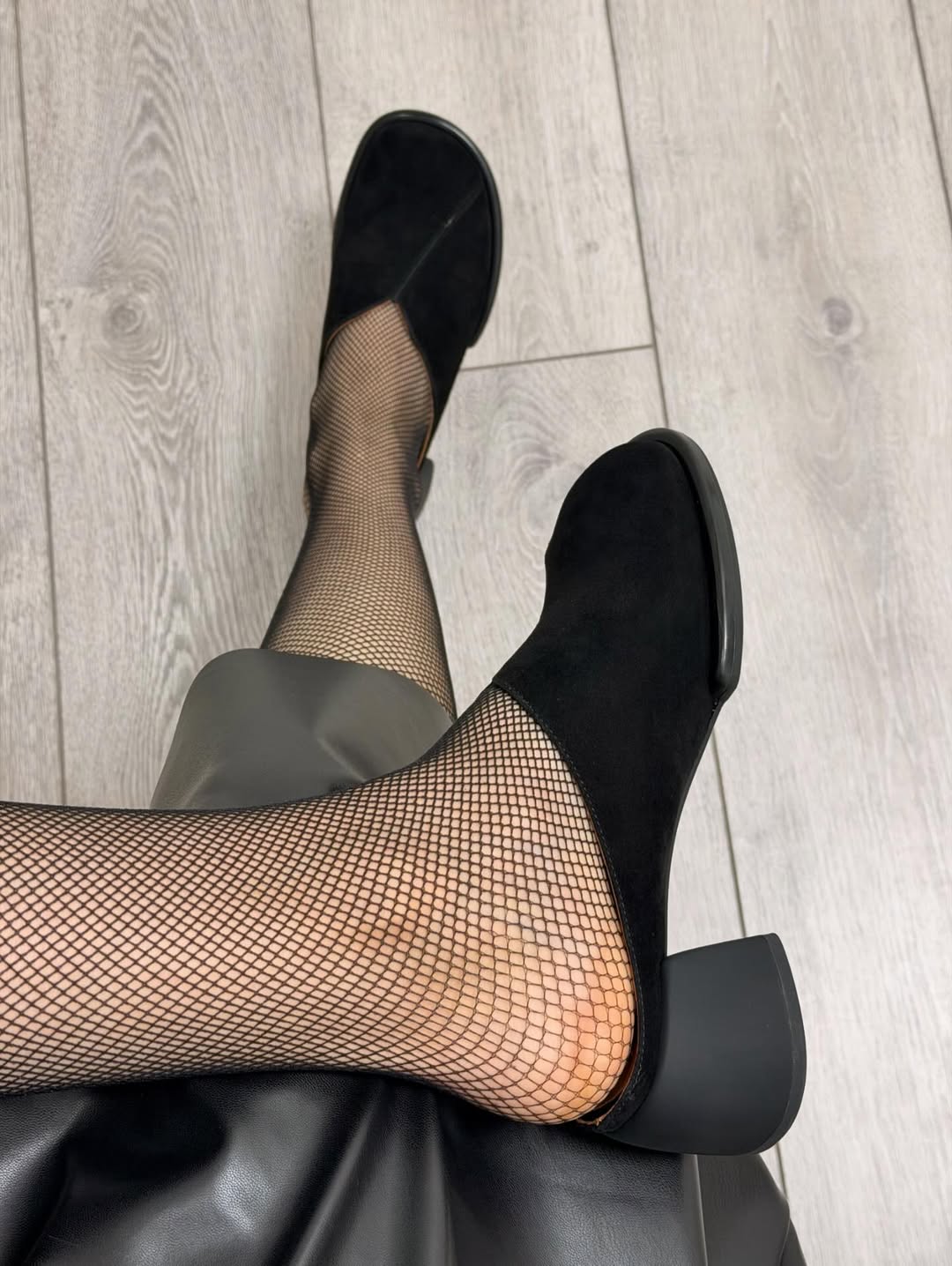 Black suede high-heeled shoes