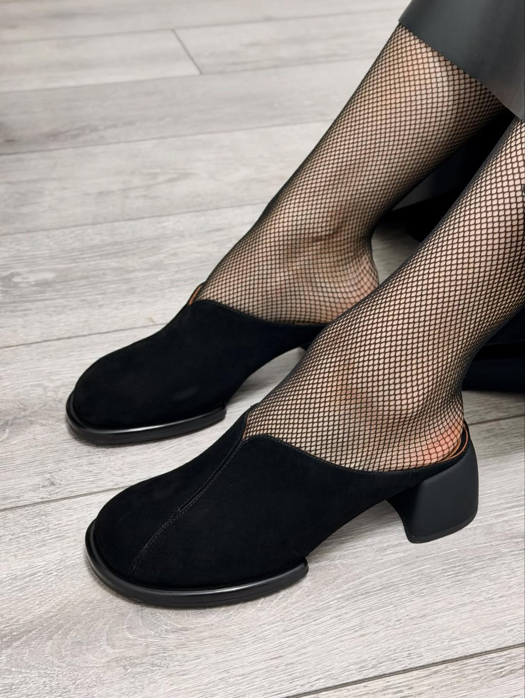 Black suede high-heeled shoes